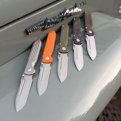 PDW SPD Invictus-SP folding knives on vintage Toyota Land Cruiser FJ43